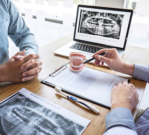 A patient consulting their dentist about treatment
