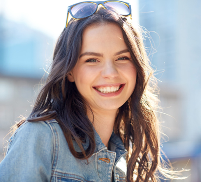 Staten Island patient smiling with new dental implants