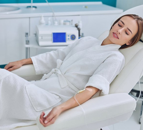 Patient with IV sedation looking relaxed in treatment chair